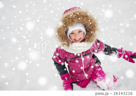 f happy little child or girl with snow in winter 26143216