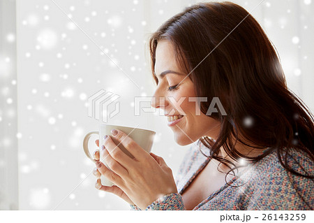happy woman with cup of tea or coffee at home happy woman with cup of tea or coffee at home 26143259