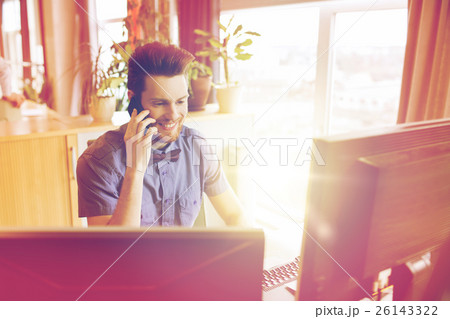 happy creative male worker calling on smarphone 26143322