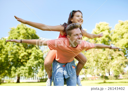 happy teenage couple having fun at summer park happy teenage couple having fun at summer park 26143402