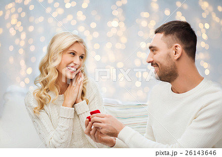 happy man giving engagement ring to woman happy man giving engagement ring to woman 26143646