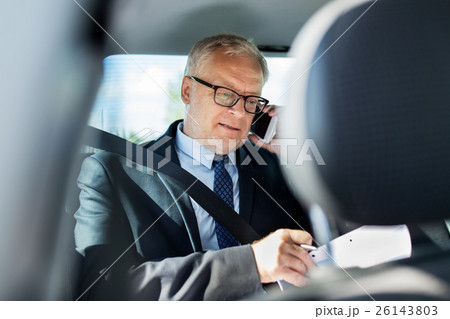 senior businessman calling on smartphone in car senior businessman calling on smartphone in car 26143803