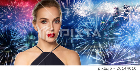 beautiful woman in black over dark background 26144010