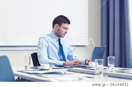 businessman with laptop working in office businessman with laptop working in office 26144031