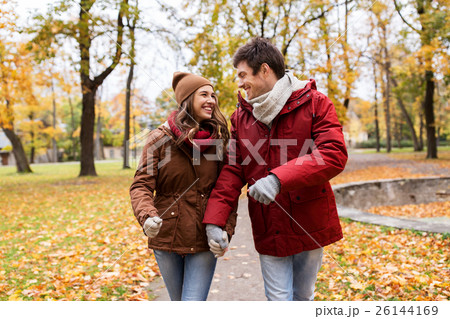happy young couple walking in autumn park 26144169
