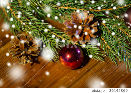 fir branch with christmas ball and pinecones fir branch with christmas ball and pinecones 26145369