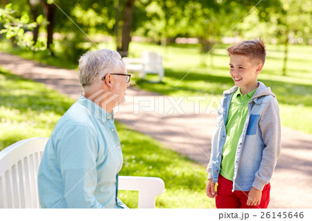 grandfather and grandson talking at summer park grandfather and grandson talking at summer park 26145646