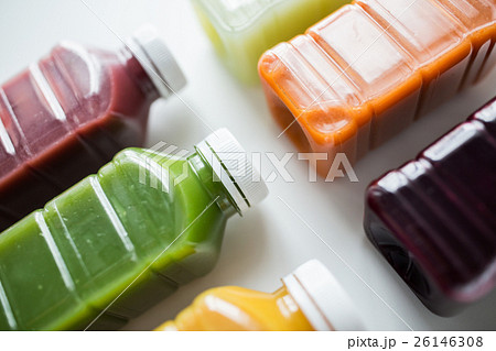 bottles with different fruit or vegetable juices 26146308
