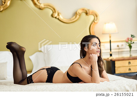 Sexy young woman in lingerie posing on the bed Sexy young woman in lingerie posing on the bed 26155021