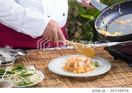 Chef putting Pad Thai to the plate 26156658