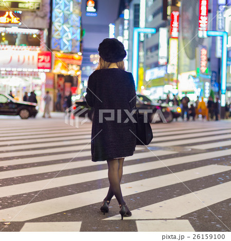 Solitary woman in Shinjuku, Tokyo, Japan. 26159100