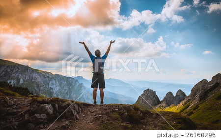 man on the top of a rock 26160296