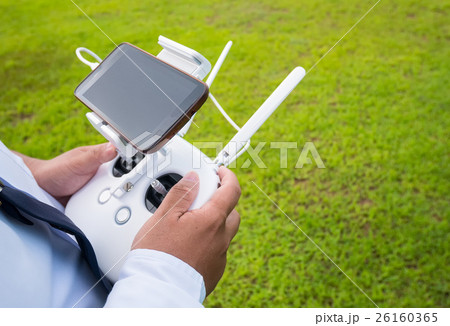 Hand holding on remote for Control drone Hand holding on remote for Control drone 26160365
