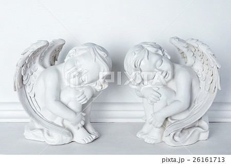 Statues of Sleeping Cupids on white background. 26161713