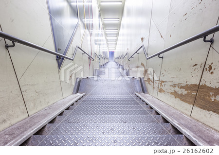 an metal staircase in a tunnel 26162602