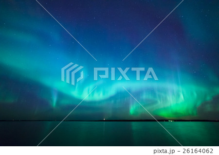 Northern lights over lake in finland 26164062