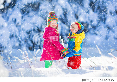 Children playing in snowy winter park Children playing in snowy winter park 26165935