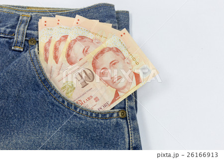 Close up Singapore dollars in a jeans pocket Close up Singapore dollars in a jeans pocket 26166913