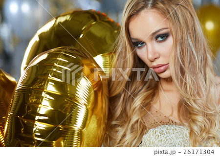 portrait of blond young woman between golden 26171304
