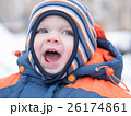 Attractive baby boy playing with the first snow 26174861