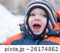 Attractive baby boy playing with the first snow 26174862