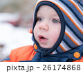 Attractive baby boy playing with the first snow 26174868