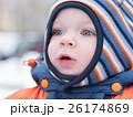 Attractive baby boy playing with the first snow 26174869