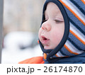 Attractive baby boy playing with the first snow 26174870