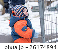 Attractive baby boy playing with the first snow 26174894