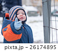 Attractive baby boy playing with the first snow 26174895