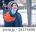 Attractive baby boy playing with the first snow 26174896