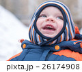Attractive baby boy playing with the first snow 26174908