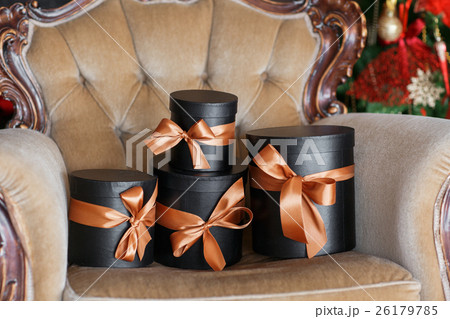 Wrapped gift black boxes with ribbons as Christmas Wrapped gift black boxes with ribbons as Christmas 26179785