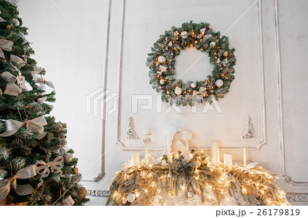 Christmas wreath of holly with white bows over the 26179819