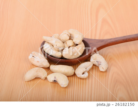 cashew nut in wooden spoon on wood table 26182150