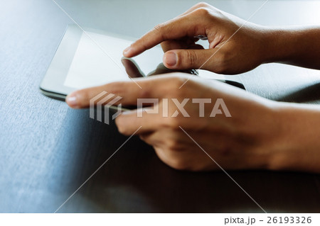 close-up hand using tablet 26193326
