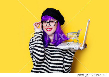 woman with shopping cart and laptop 26197180