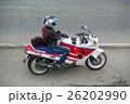 Biker in a helmet sitting on his motorcycle. 26202990