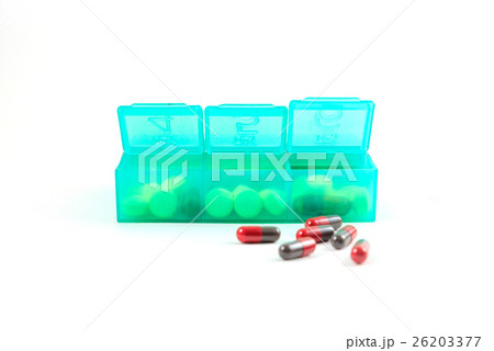 Green plastic daily pill organizer shot  26203377