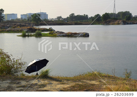 rocky lake with small river islet 26203699