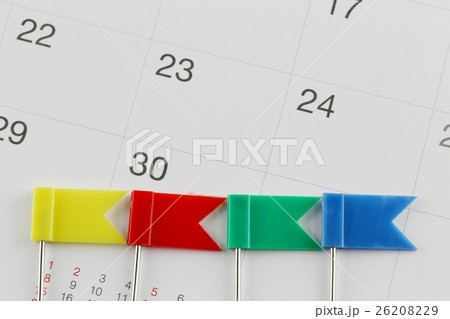 Pins to Placed on the calendar beside the number of thirty in business concept time and date. 26208229