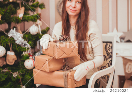 Girl with gift boxes Girl with gift boxes 26210024