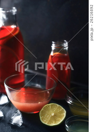 Citrus cocktail in the different glass bottle  26216892