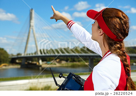 Woman is standing and holding drone 26220524