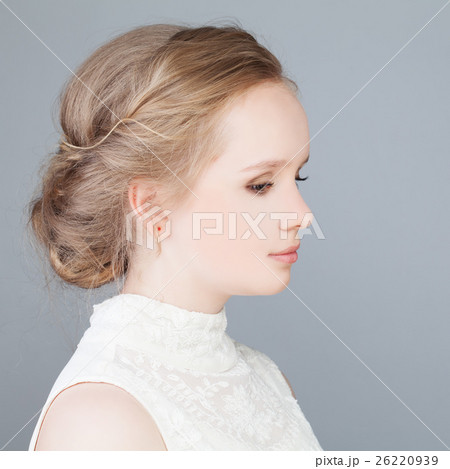 Cute Blonde Girl with Prom Hairstyle. Profile 26220939