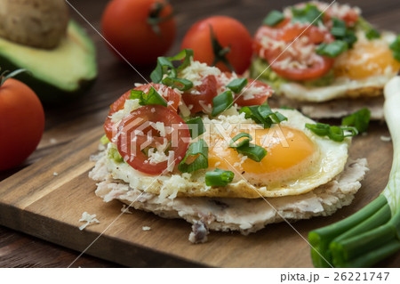 Huevos rancheros tostadas with avocado salsa 26221747