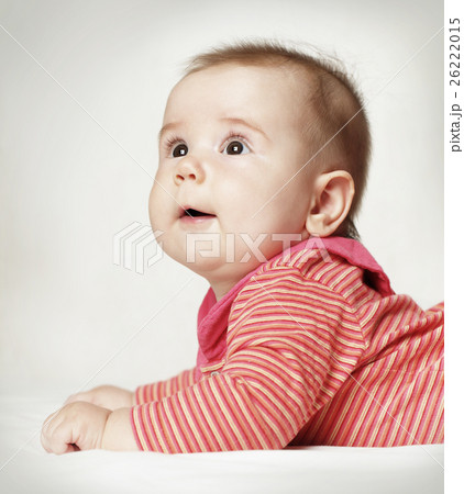 Cute surprised baby looking up 26222015