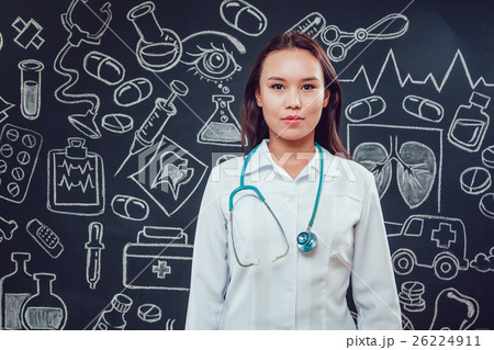Young woman doctor in glasses and white coat 26224911