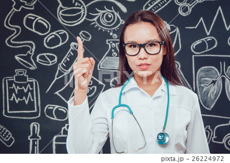 Young woman doctor in glasses and white coat 26224972