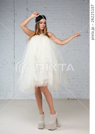 Woman in tutu skirt instead dresses in studio Woman in tutu skirt instead dresses in studio 26225187